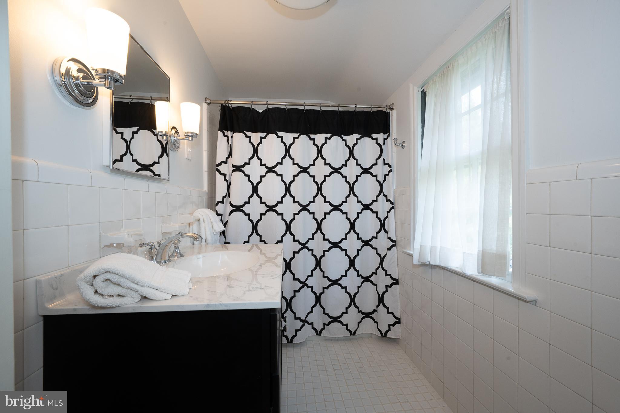 510 Lynmere Road Bryn Mawr, PA 19010 - Photo 32 of 44 a bathroom with a sink and a mirror