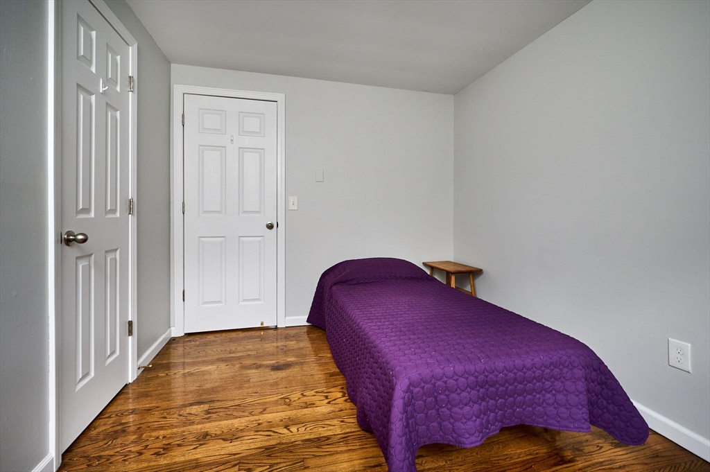 48 Austin Circle Northampton, MA 01062 - Photo 14 of 33 a bedroom with a bed and wooden floor