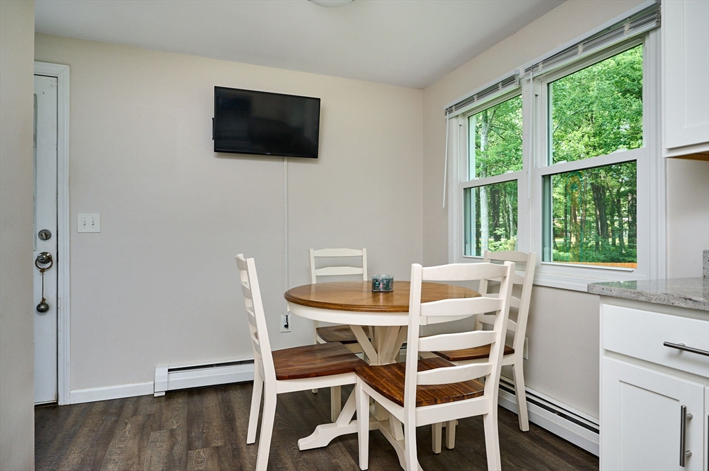 48 Austin Circle Northampton, MA 01062 - Photo 6 of 33 a dining room with furniture and a flat screen tv