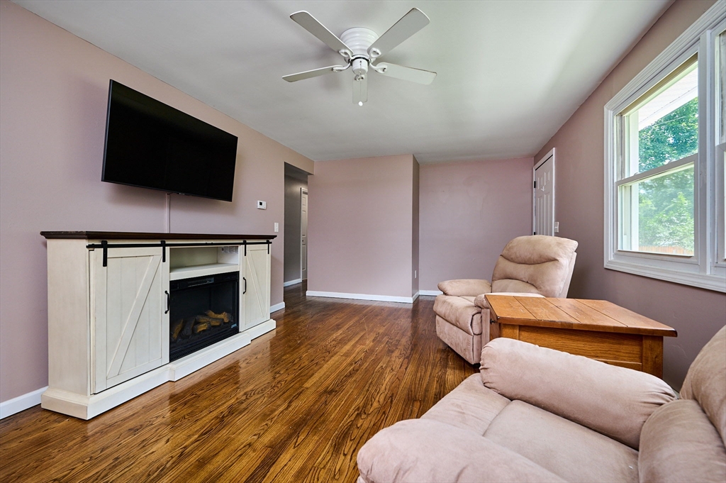 48 Austin Circle Northampton, MA 01062 - Photo 8 of 33 a living room with furniture a flat screen tv and a fireplace