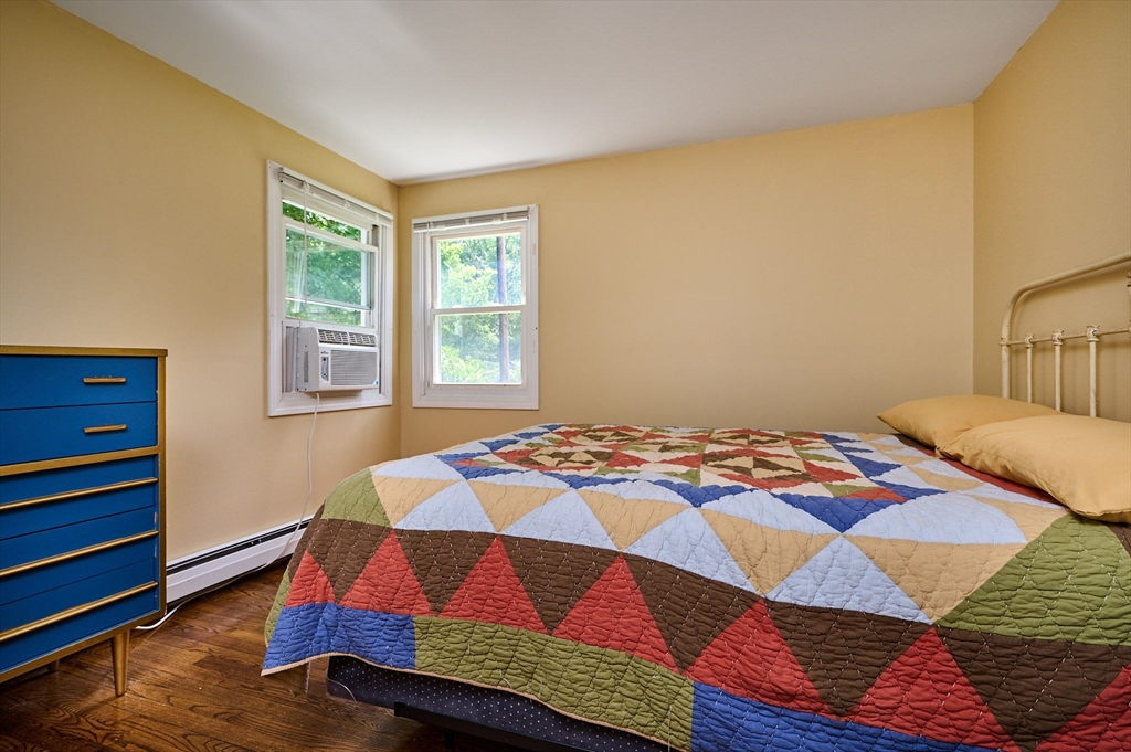 48 Austin Circle Northampton, MA 01062 - Photo 9 of 33 a bedroom with a bed and wooden floor