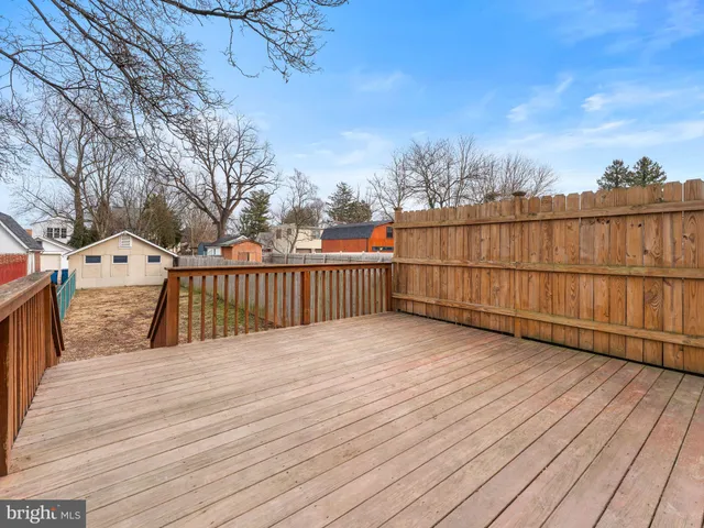 a view of a house with wooden deck
