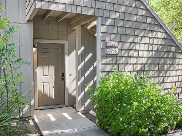 a view of a house with a small yard
