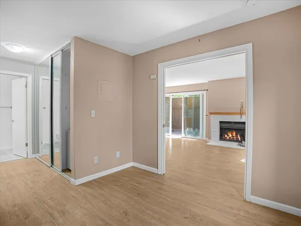 a bathroom with a tub a sink and a large mirror
