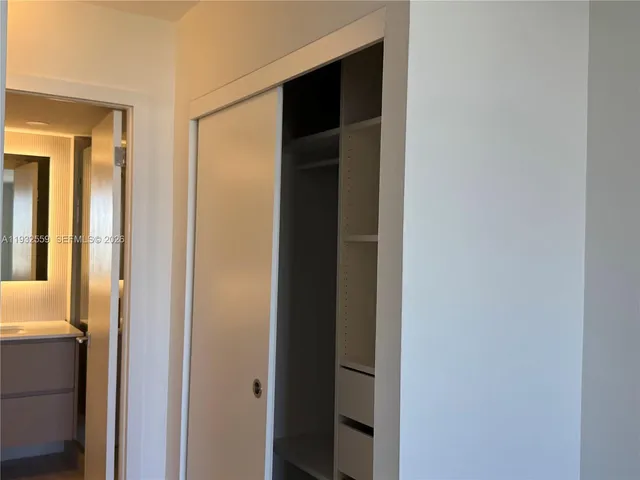 a view of a bathroom from a hallway