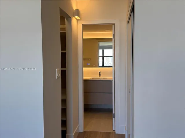 a view of a kitchen cabinets and wooden floor