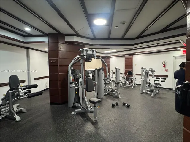 a room with wooden floor and furniture