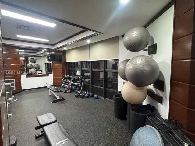 a living room with a table and a wooden floor