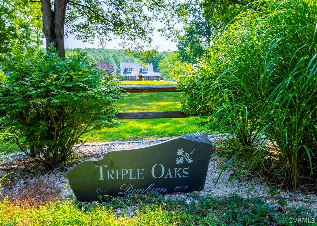 3676 Bell Road Dillwyn, VA 23936 - Photo 2 of 50 a sign that is sitting in front of a tree