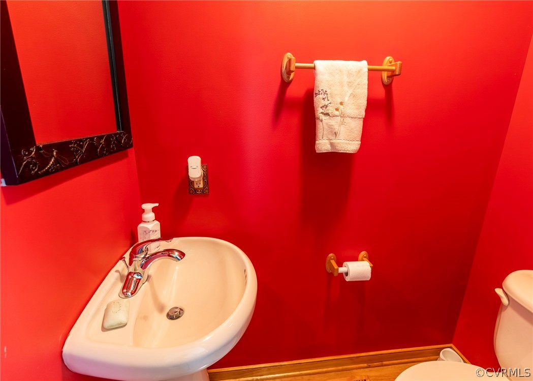 3676 Bell Road Dillwyn, VA 23936 - Photo 38 of 50 a bathroom with a sink mirror and toilet