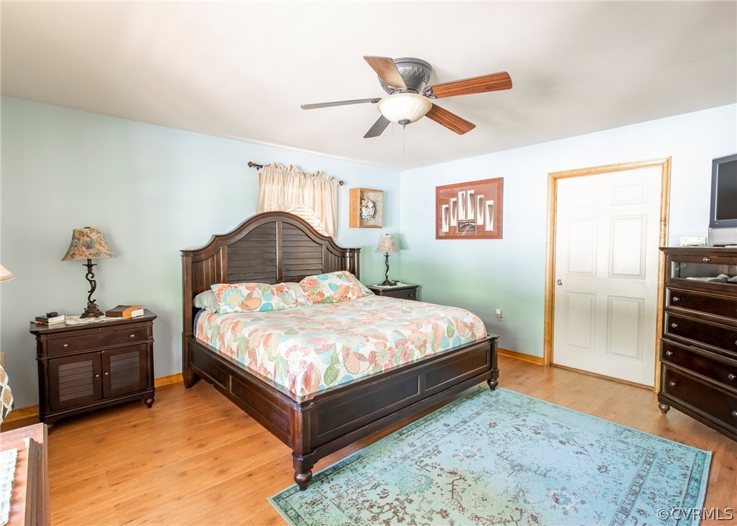 3676 Bell Road Dillwyn, VA 23936 - Photo 40 of 50 a bedroom with a bed and a chandelier
