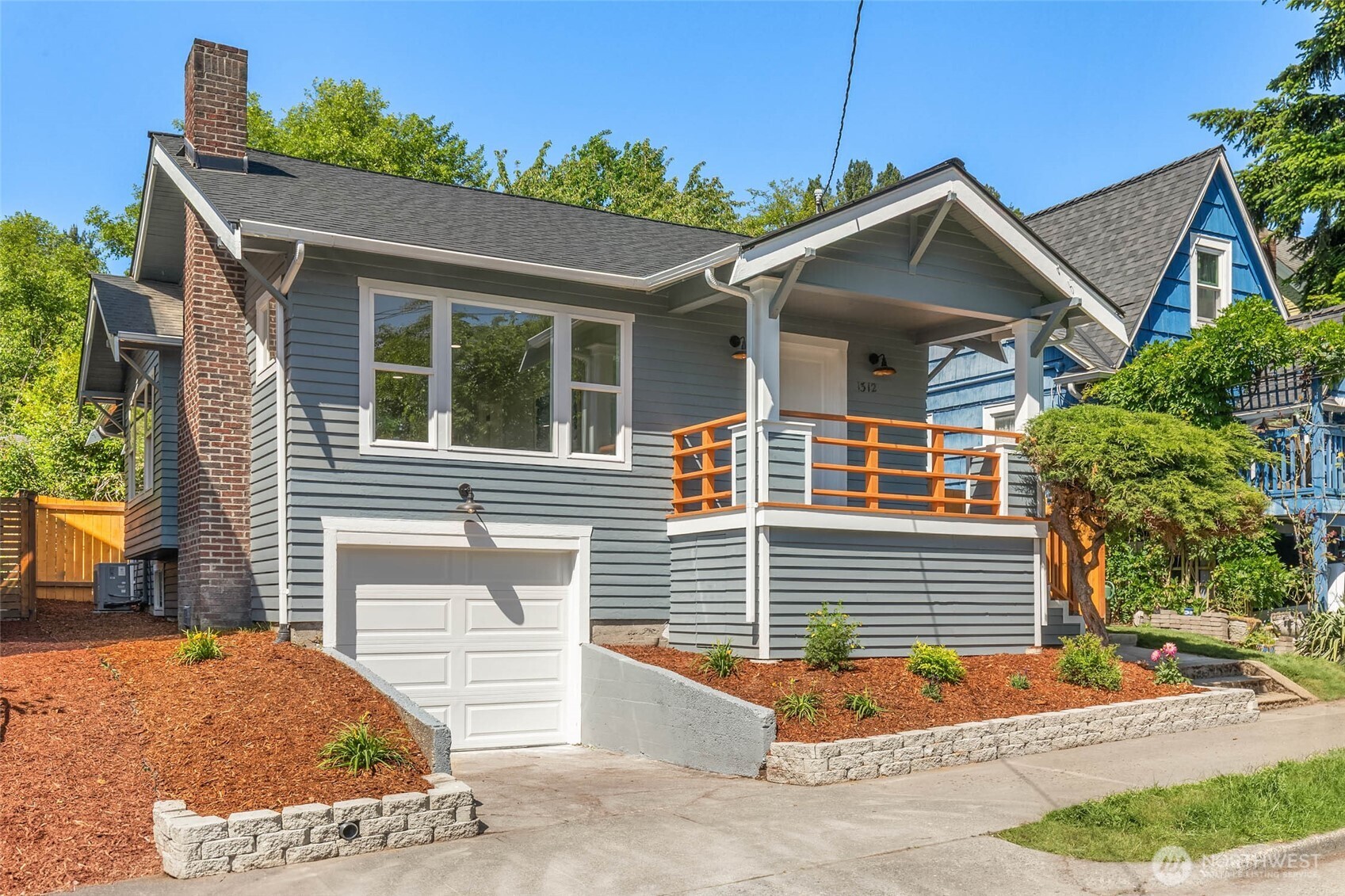 a front view of a house with garage