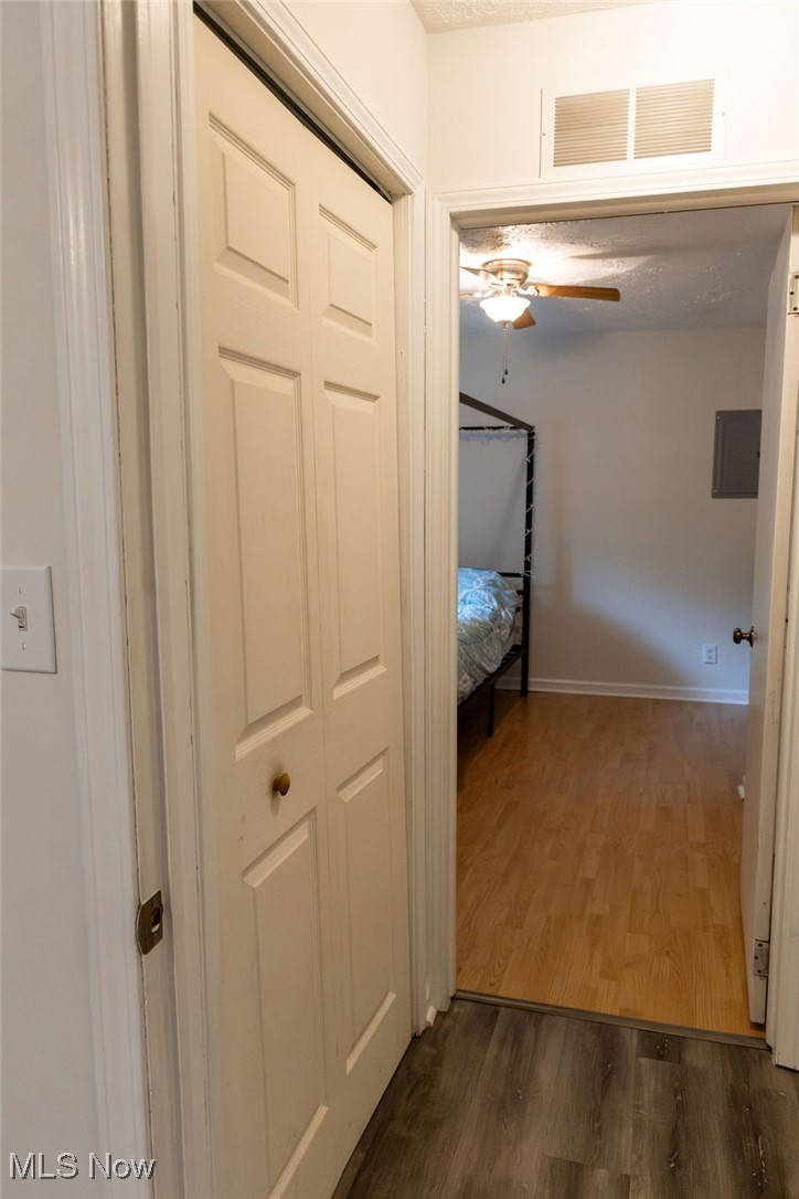 1995 Benjamin Road Madison, OH 44057 - Photo 14 of 50 Corridor featuring dark wood-style floors and baseboards