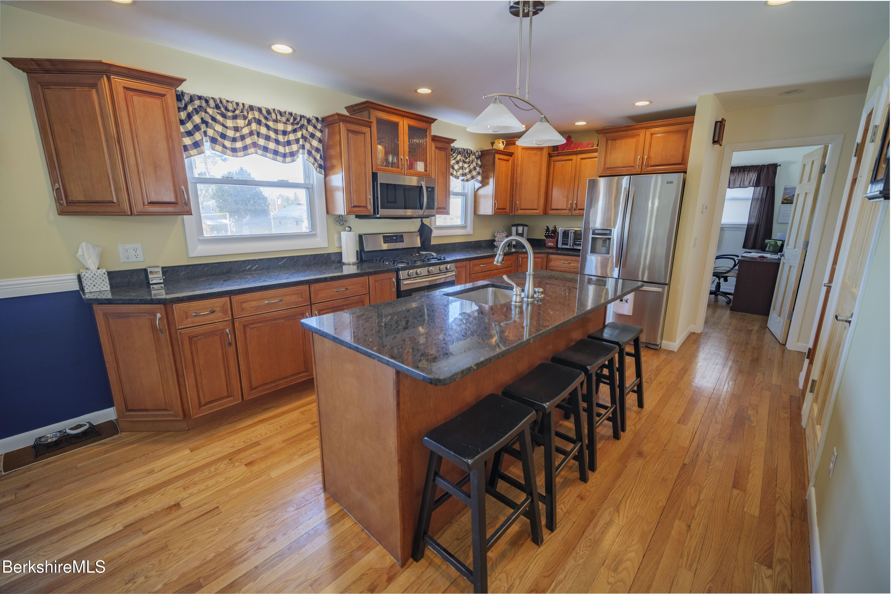 582 East New Lenox Road Pittsfield, MA 01201 - Photo 5 of 23 a kitchen with stainless steel appliances granite countertop a sink a stove and a wooden floors