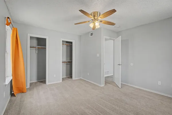 a view of a bedroom with a chandelier