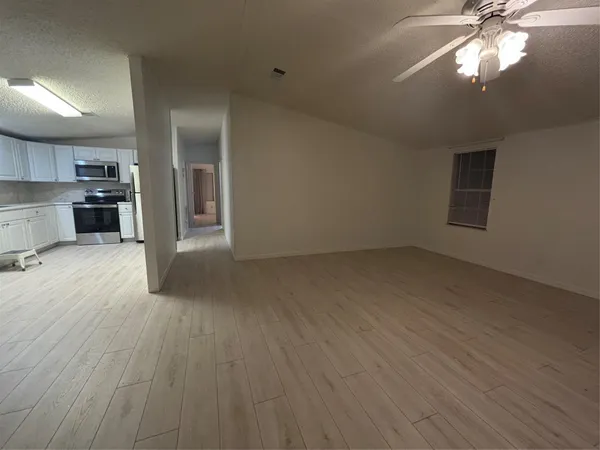 a view of a kitchen with a sink and dishwasher