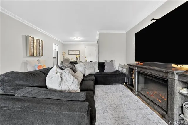 a bedroom with furniture and a flat screen tv