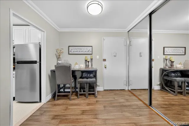 a view of a kitchen with refrigerator and chair