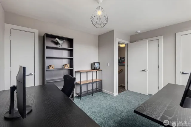 a view of a livingroom with furniture and a window