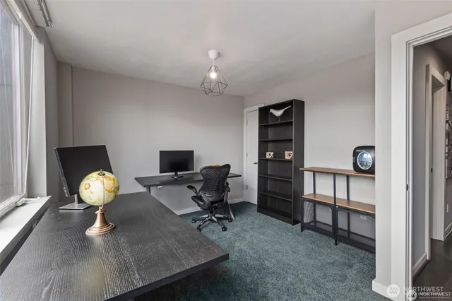 a workspace with furniture and window