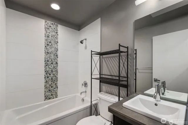 a bathroom with a bathtub and a sink