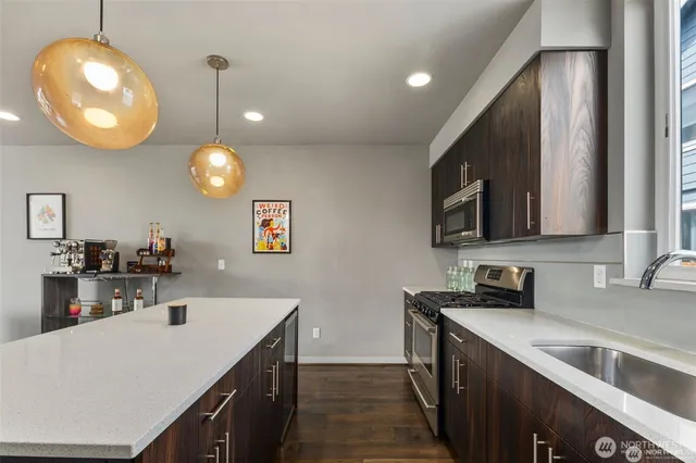 a kitchen with a sink cabinets and window