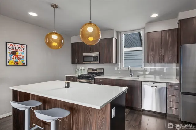 a kitchen with a table and chairs in it