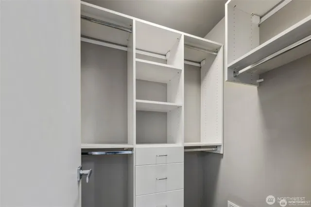 a view of an empty walk in closet