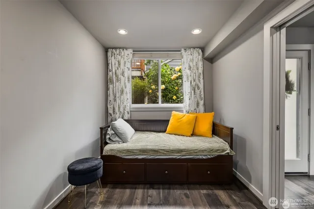 a bedroom with a bed and window