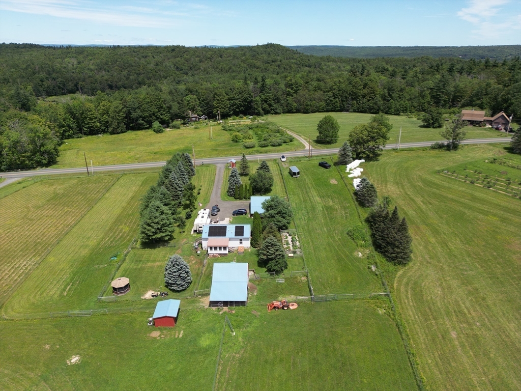 527 Old Post Road Worthington, MA 01098 - Photo 3 of 39 a view of a houses with a big yard