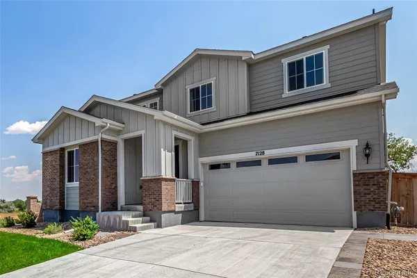 a front view of a house with yard