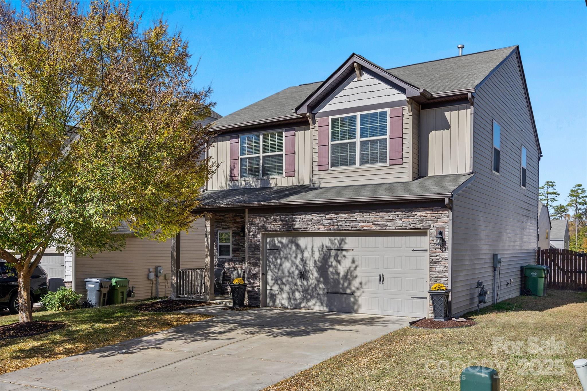 2811 Berry Creek Road Charlotte, NC 28214 - Photo 1 of 20 a front view of a house with a garden