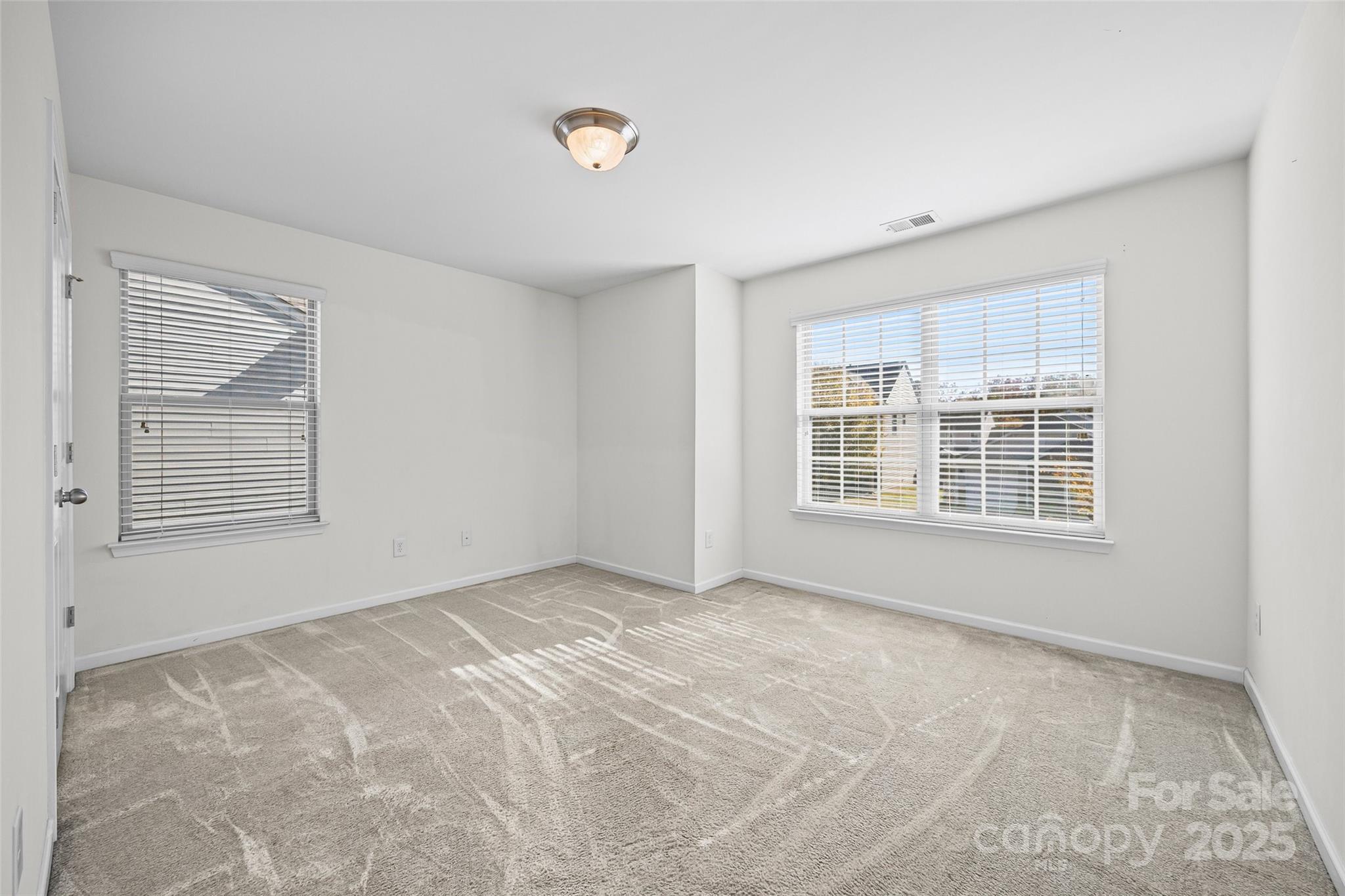 2811 Berry Creek Road Charlotte, NC 28214 - Photo 12 of 20 a view of an empty room with a window