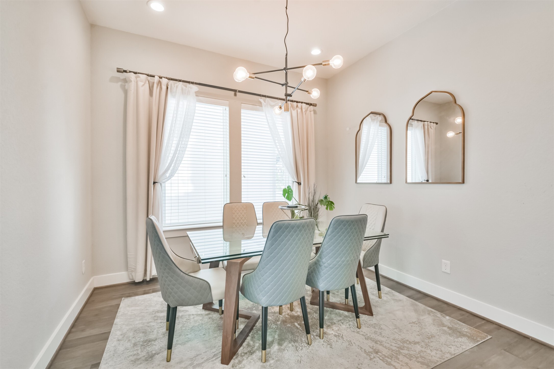 8411 Hempstead Road, Unit H Houston, TX 77008 - Photo 21 of 40 A formal dining room featuring an elegant wooden dining table with matching chairs, surrounded by soft, neutral-toned walls.