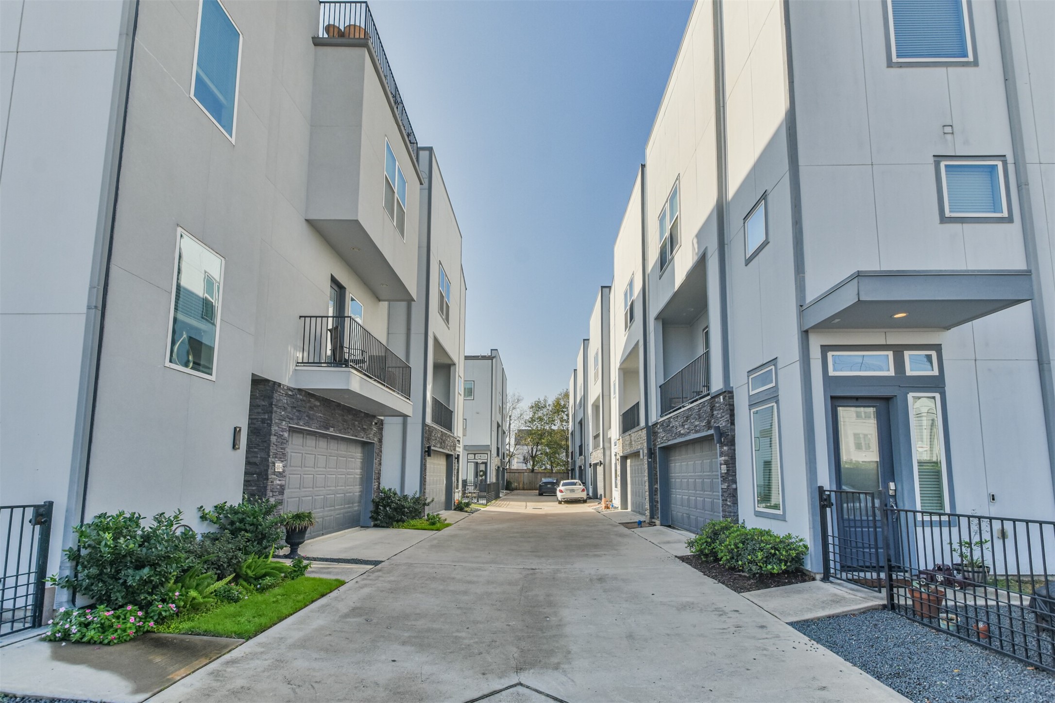 8411 Hempstead Road, Unit H Houston, TX 77008 - Photo 3 of 40 These contemporary townhomes feature a well-planned layout with generous space between the units, ensuring privacy and a comfortable living environment.