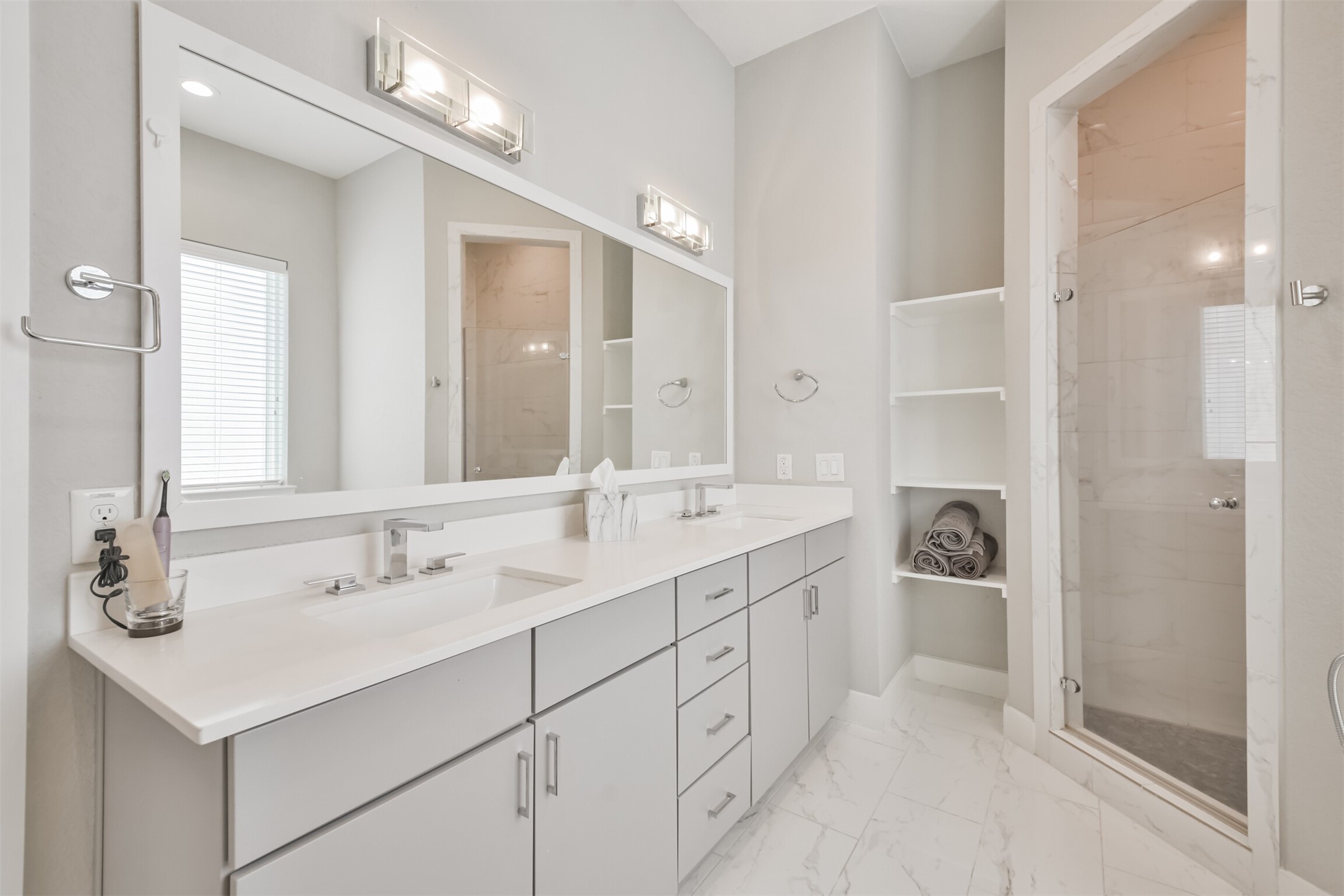 8411 Hempstead Road, Unit H Houston, TX 77008 - Photo 35 of 40 Luxurious finishes with a walk-in shower, a soaking tub, and a sleek double vanity.