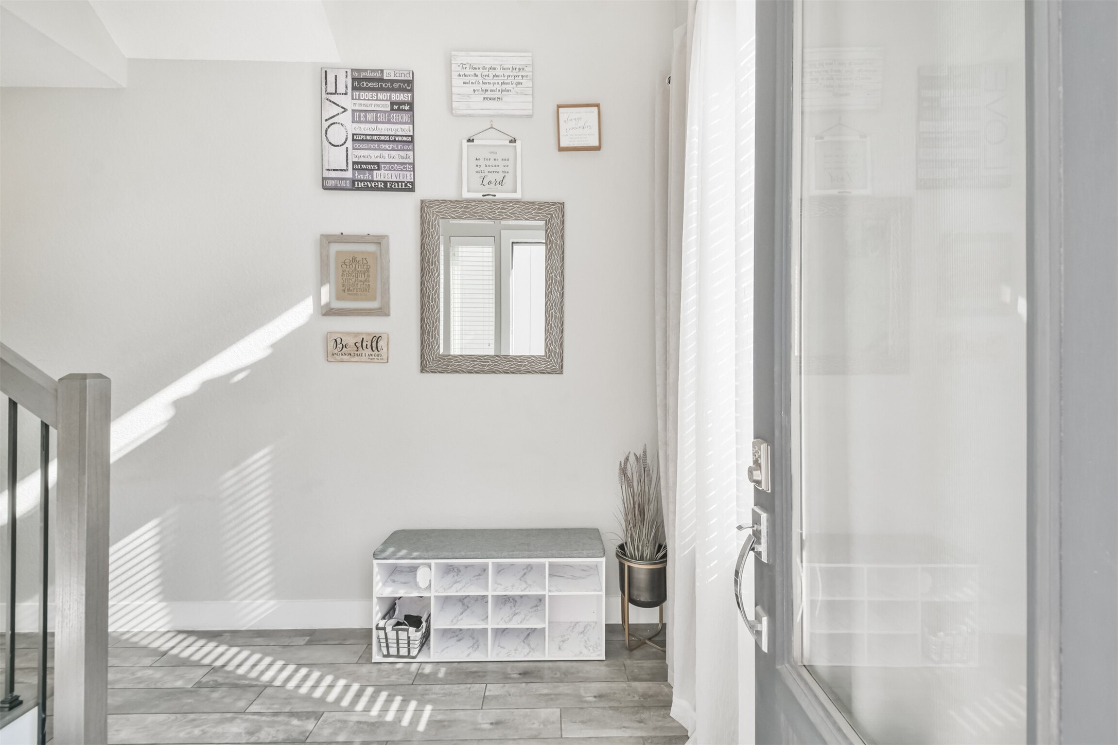 8411 Hempstead Road, Unit H Houston, TX 77008 - Photo 5 of 40 Step into a charming, light-filled entryway with sleek finishes and a modern design, setting the tone for the stylish interior of this home.