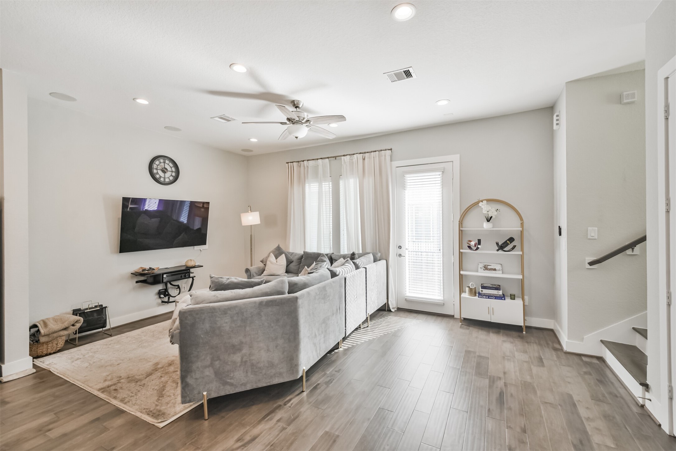 8411 Hempstead Road, Unit H Houston, TX 77008 - Photo 10 of 40 A bright and inviting living room featuring sleek canned lighting along the ceiling, providing a modern touch.