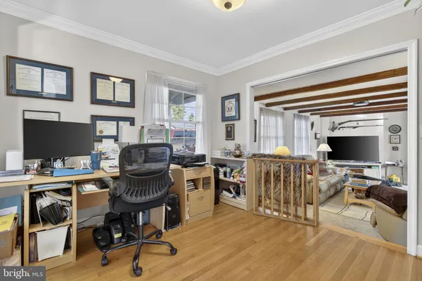 a living room with furniture a fireplace and a window