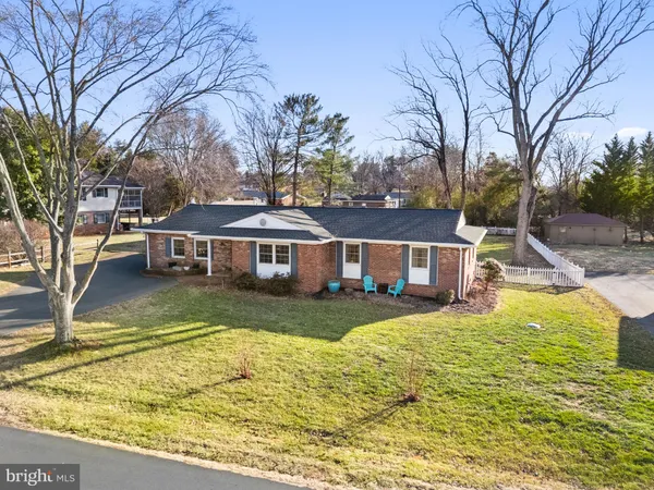 a view of a yard with a house in the background