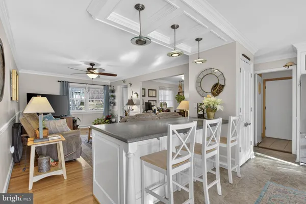 a kitchen with stainless steel appliances granite countertop a sink a stove and refrigerator