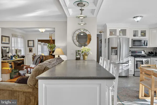 a cabinet with white and a wooden floor