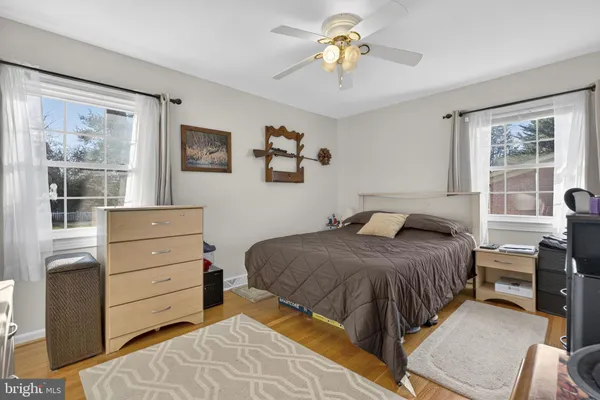a bathroom with a sink toilet a mirror and shower
