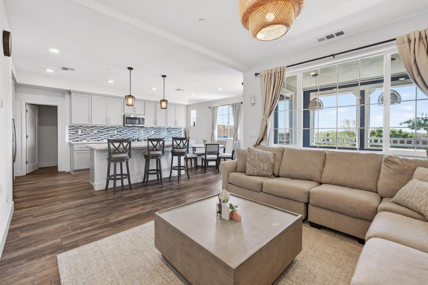 9532 Seawind Way Newark, CA 94560 - Photo 14 of 44 a living room with furniture kitchen and a chandelier