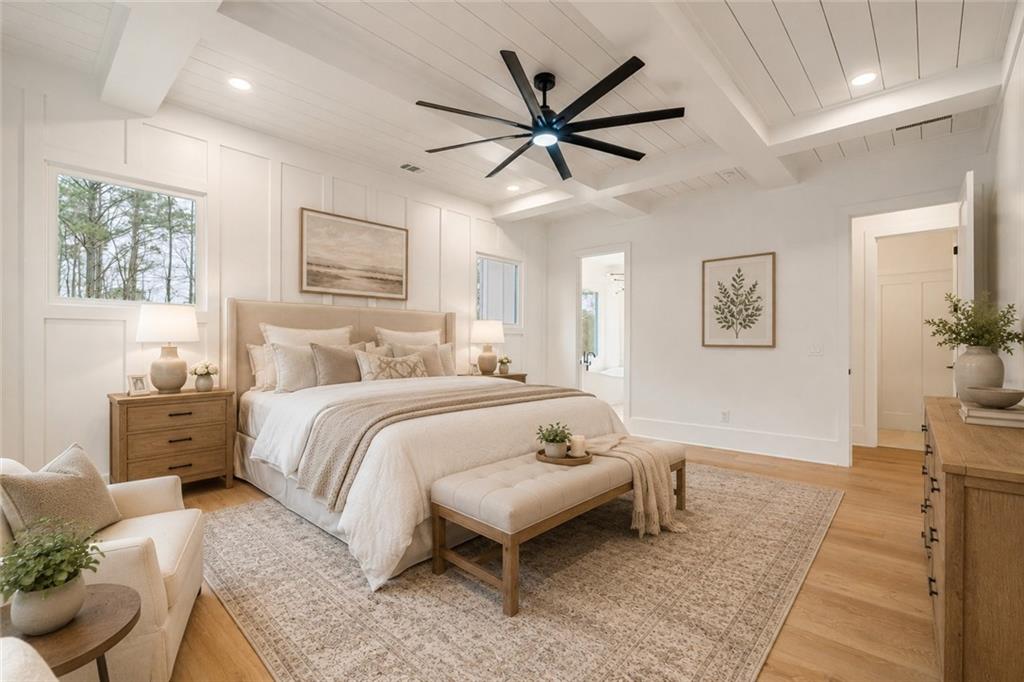 555 Lower Birmingham Road Canton, GA 30115 - Photo 26 of 104 a bedroom with a large bed and a chandelier