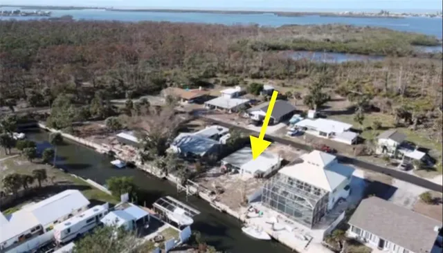 an aerial view of a house with a swimming pool