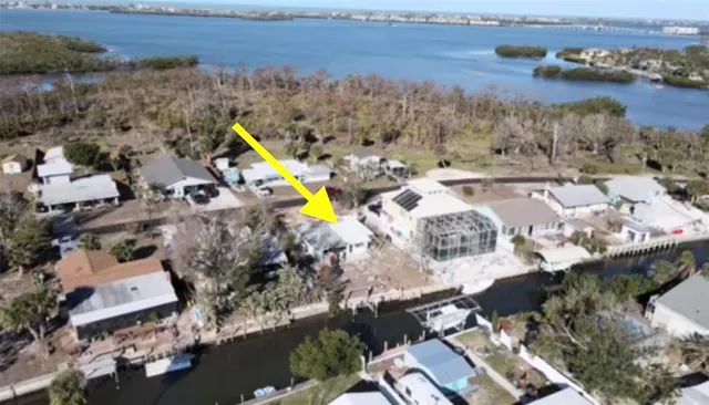 an aerial view of a city with mountains