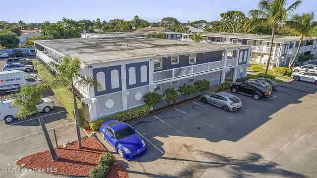 an aerial view of a house with a garden and plants