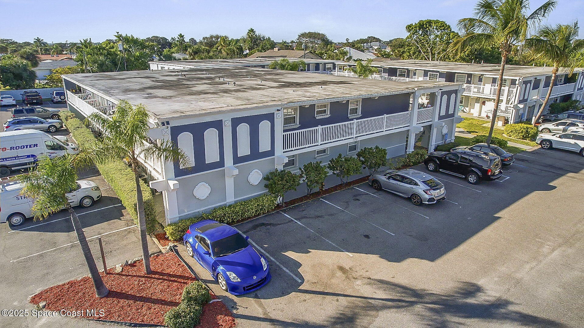 1170 South Patrick Drive, Unit 29 Satellite Beach, FL 32937 - Photo 1 of 18 an aerial view of a house with a garden and plants