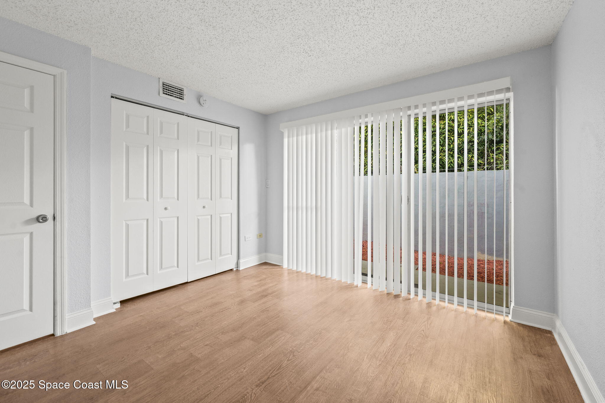 1170 South Patrick Drive, Unit 29 Satellite Beach, FL 32937 - Photo 16 of 18 a view of a livingroom with a wooden floor